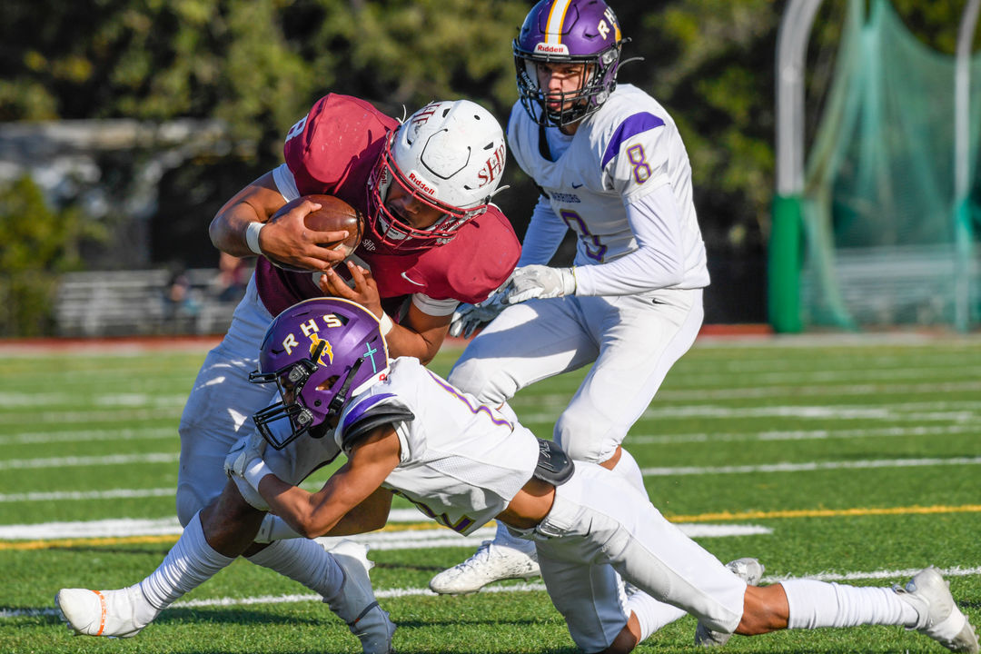 Elroy Perez (12) tackles Andrew Latu (8) at the CIF 5-A State Championship Game